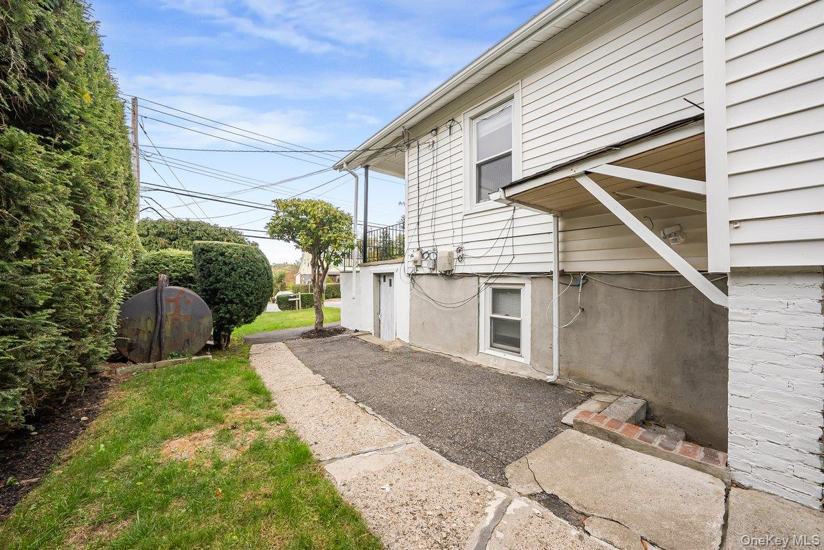 151 Babbitt Road Bedford Hills, NY 10507 - Photo 17 of 23 a view of backyard with large tree and wooden fence