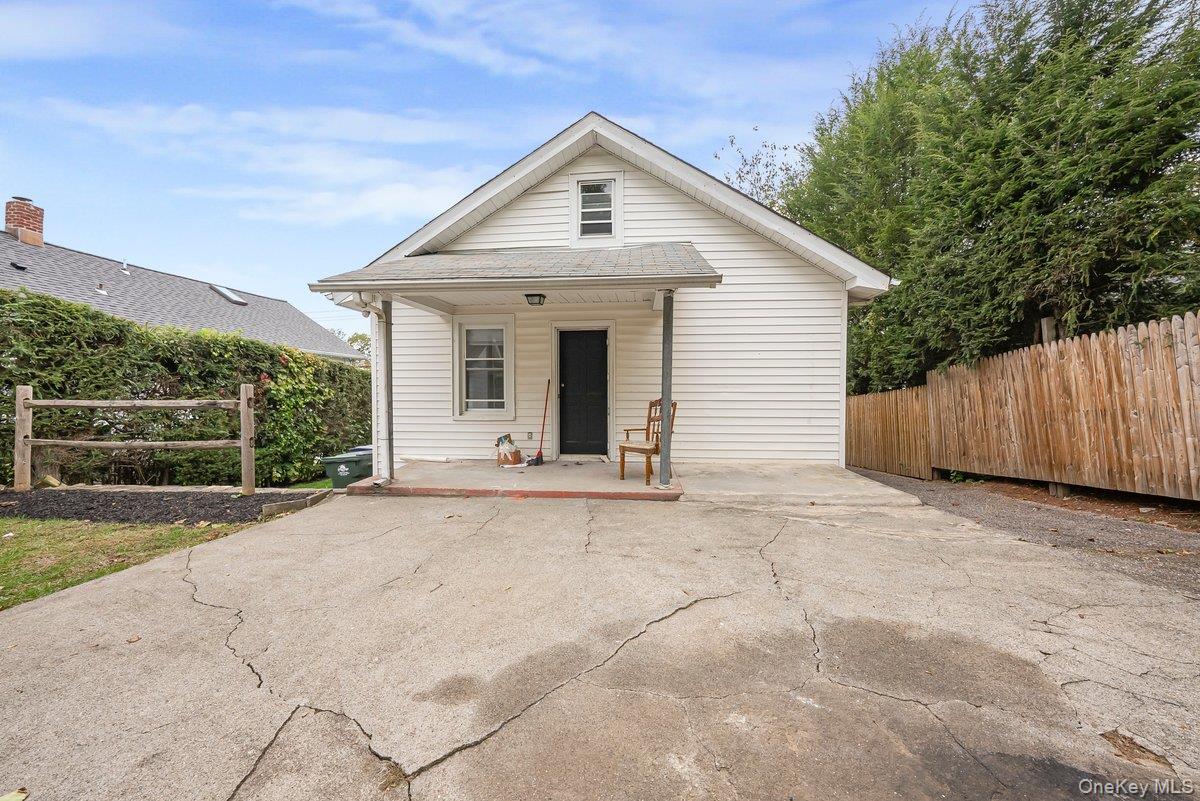 151 Babbitt Road Bedford Hills, NY 10507 - Photo 20 of 23 a front view of a house with a yard and garage