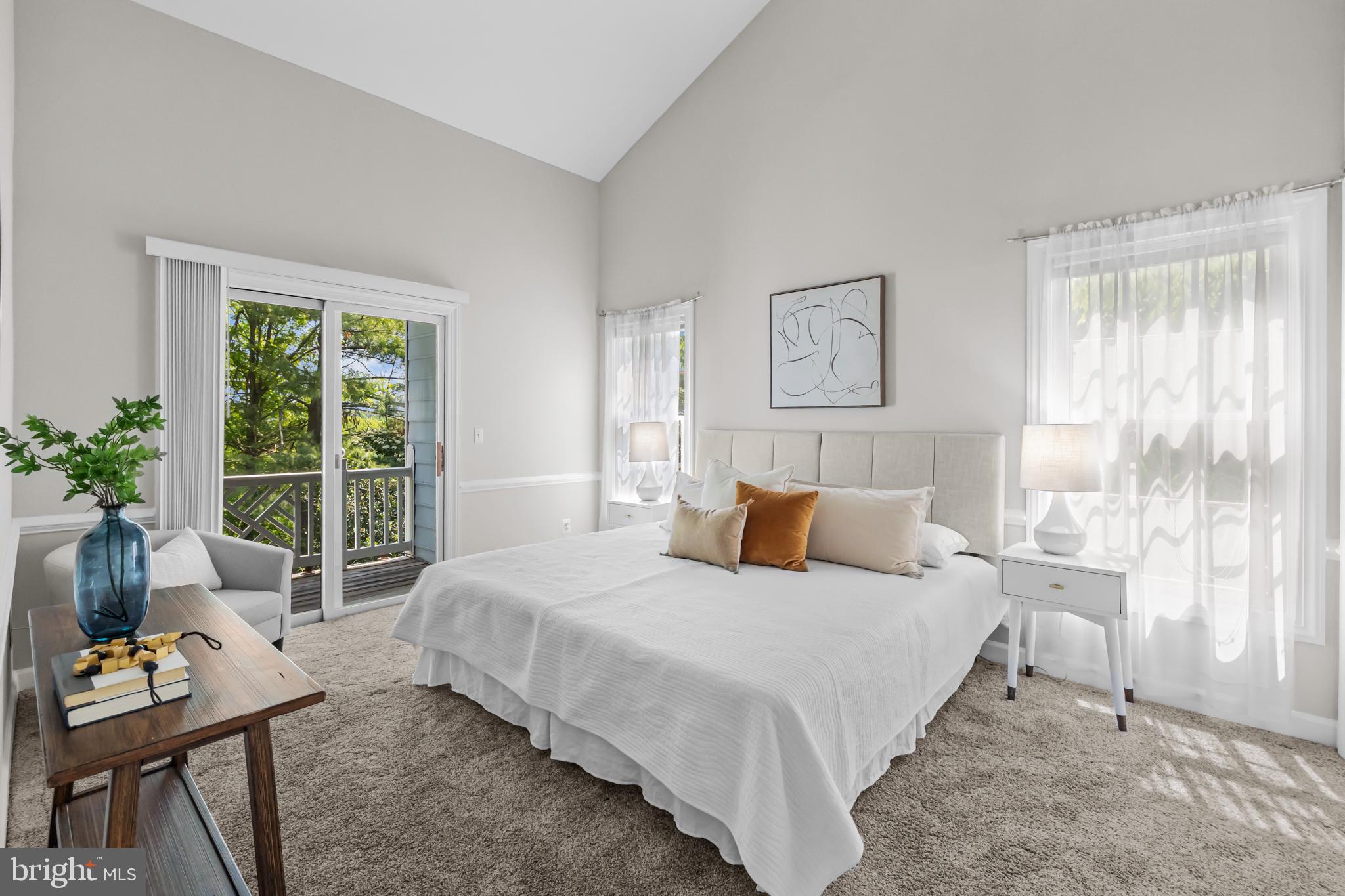 17045 Islip Loop, Unit 303 Dumfries, VA 22026 - Photo 20 of 48 a bedroom with a bed and large window