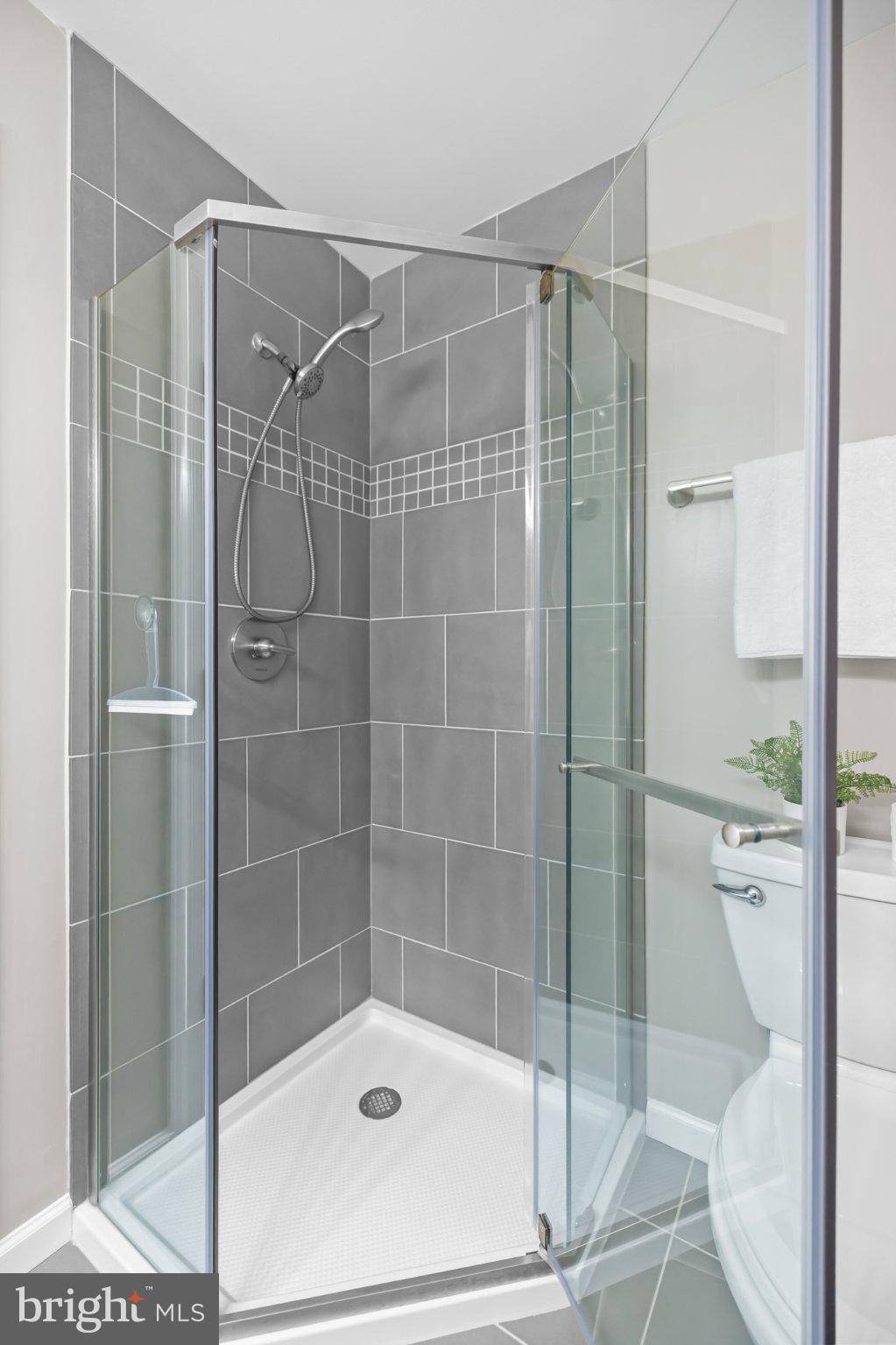 17045 Islip Loop, Unit 303 Dumfries, VA 22026 - Photo 37 of 48 a bathroom with a shower