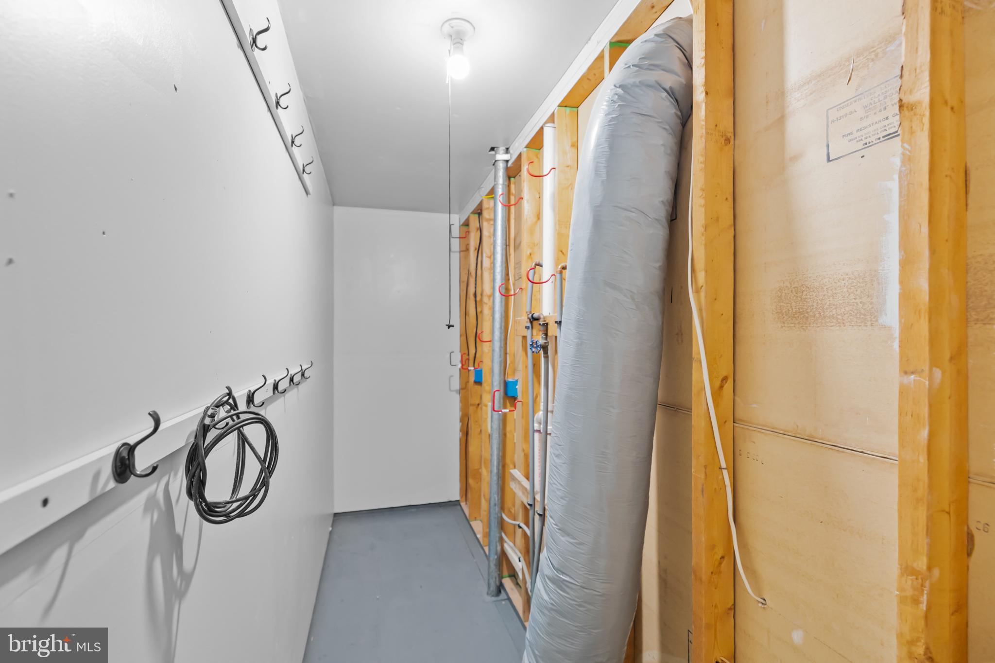 17045 Islip Loop, Unit 303 Dumfries, VA 22026 - Photo 39 of 48 a view of a hallway with painted walls