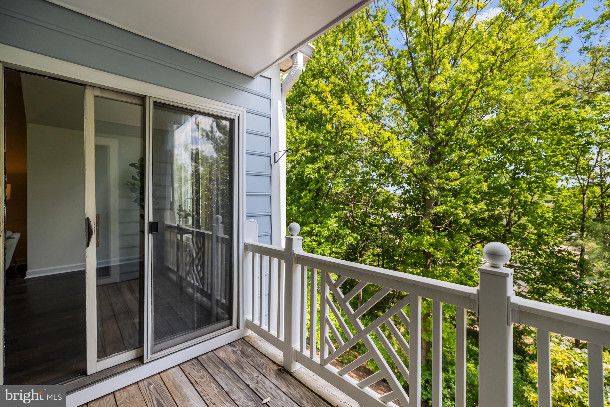 17045 Islip Loop, Unit 303 Dumfries, VA 22026 - Photo 41 of 48 a view of a balcony with wooden floor