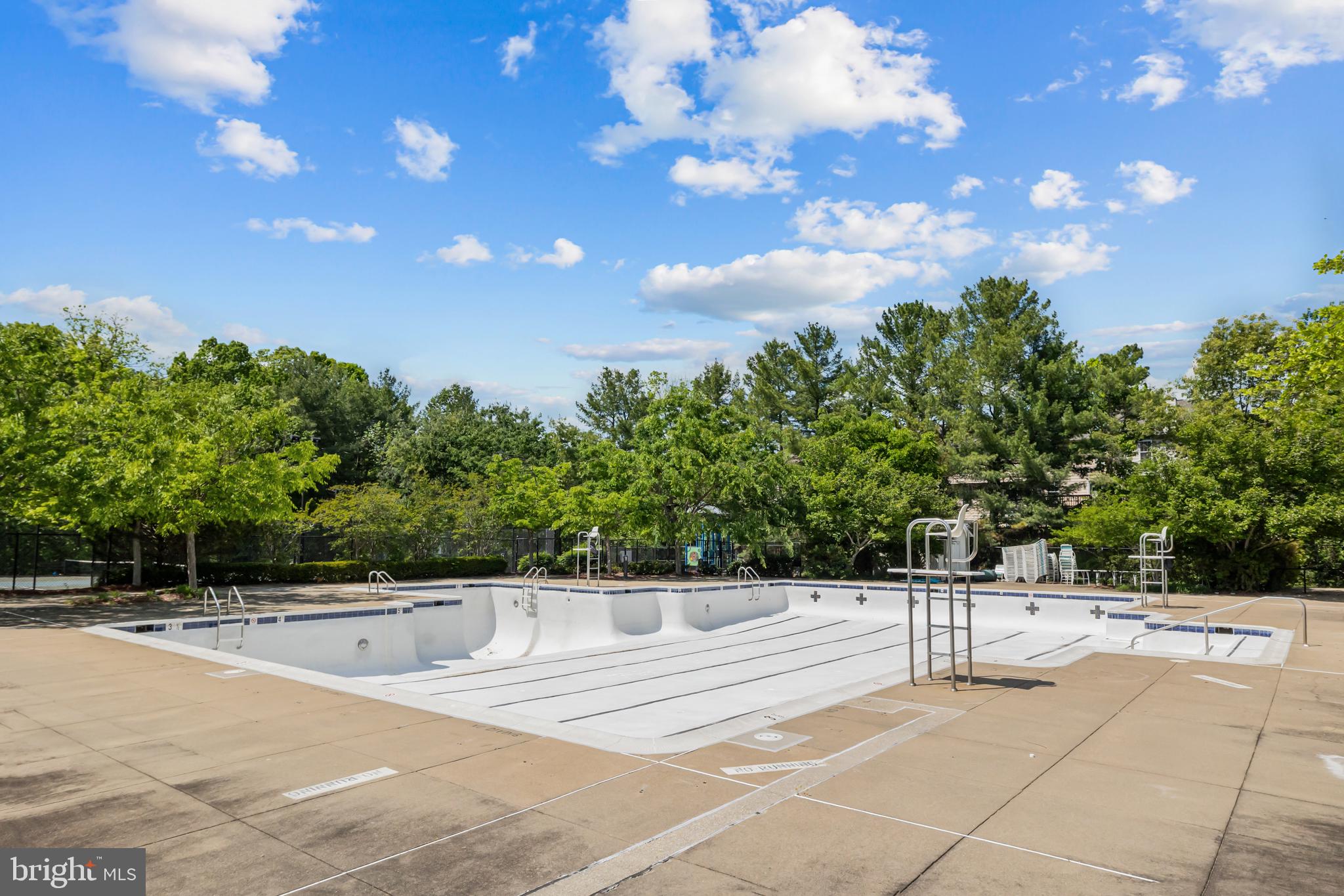 17045 Islip Loop, Unit 303 Dumfries, VA 22026 - Photo 43 of 48 a view of an outdoor space and tennis court