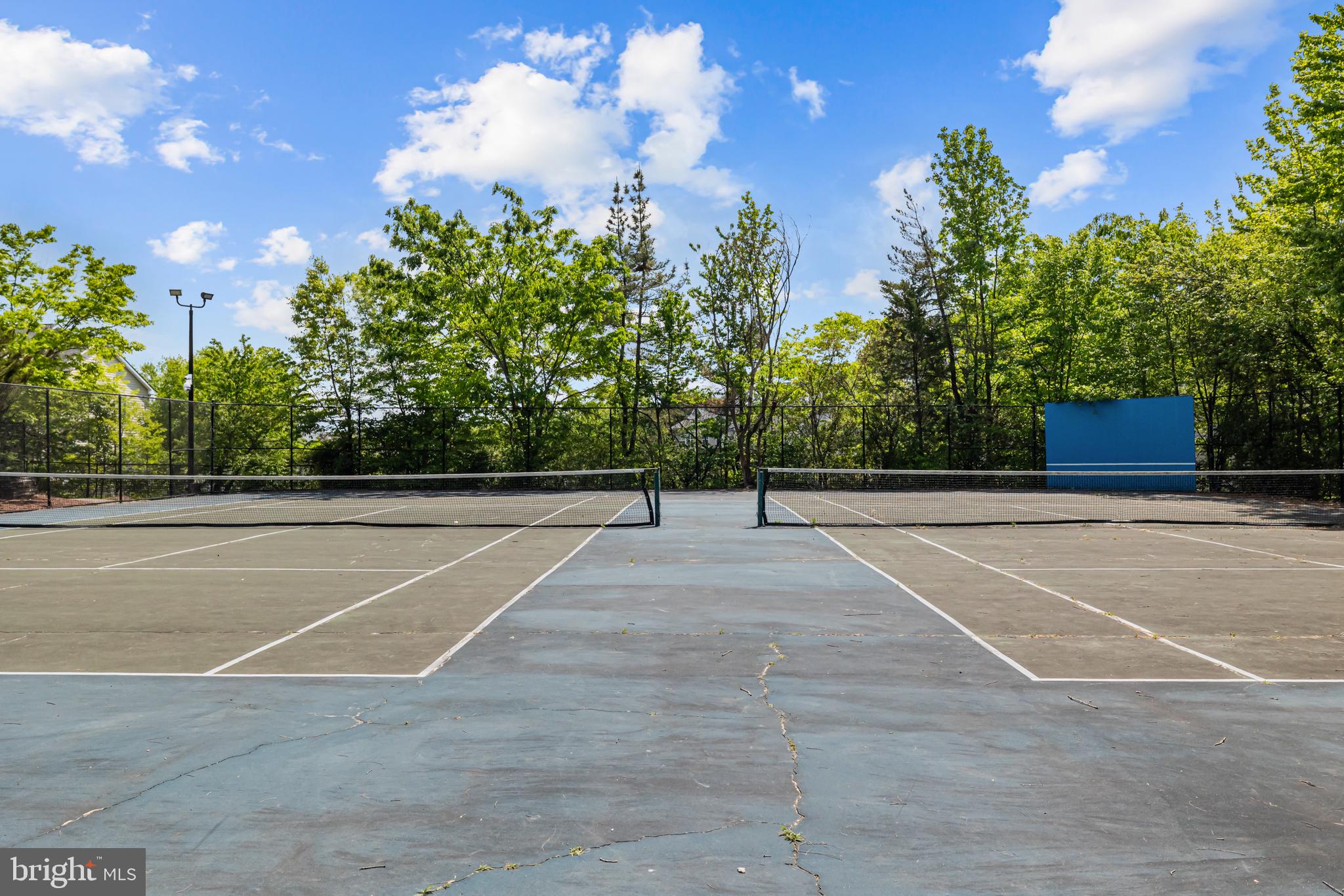 17045 Islip Loop, Unit 303 Dumfries, VA 22026 - Photo 45 of 48 a view of a tennis court