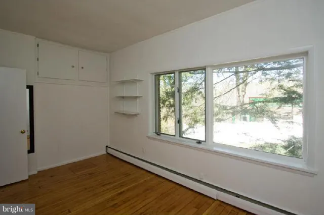 a front view of a building with garden