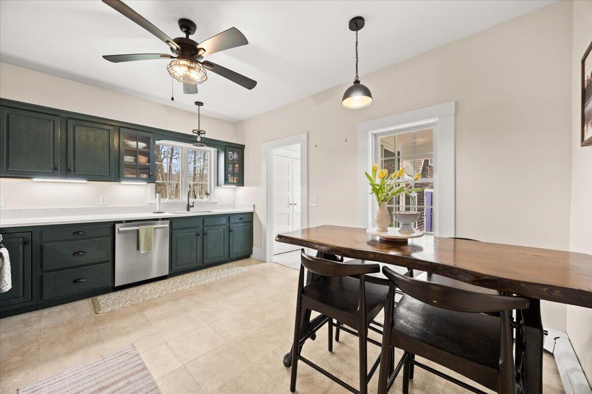 729 Center Street Dighton, MA 02764 - Photo 11 of 62 a kitchen with a table chairs cabinets and appliances