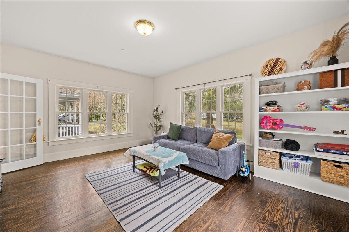 729 Center Street Dighton, MA 02764 - Photo 19 of 62 a living room with furniture and a book shelf