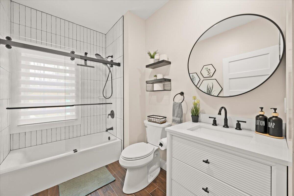 729 Center Street Dighton, MA 02764 - Photo 20 of 62 a bathroom with a toilet a sink and a mirror