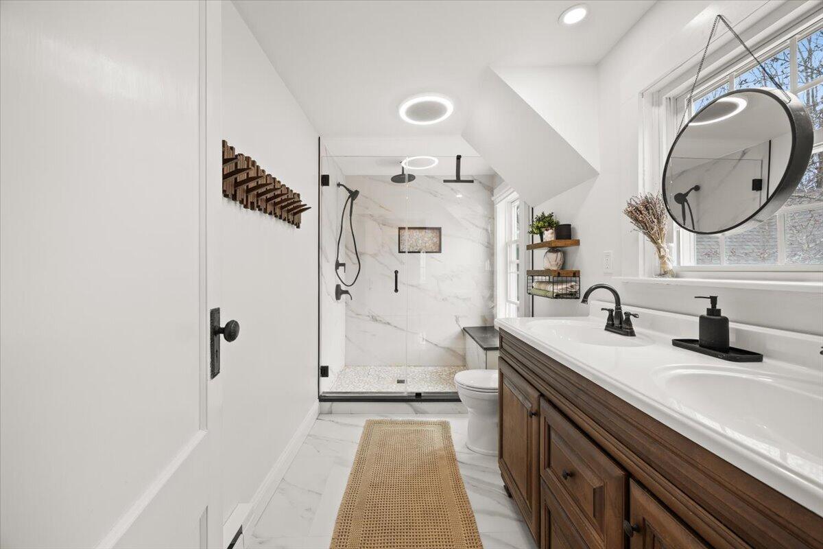 729 Center Street Dighton, MA 02764 - Photo 25 of 62 a spacious bathroom with a granite countertop sink mirror and a shower