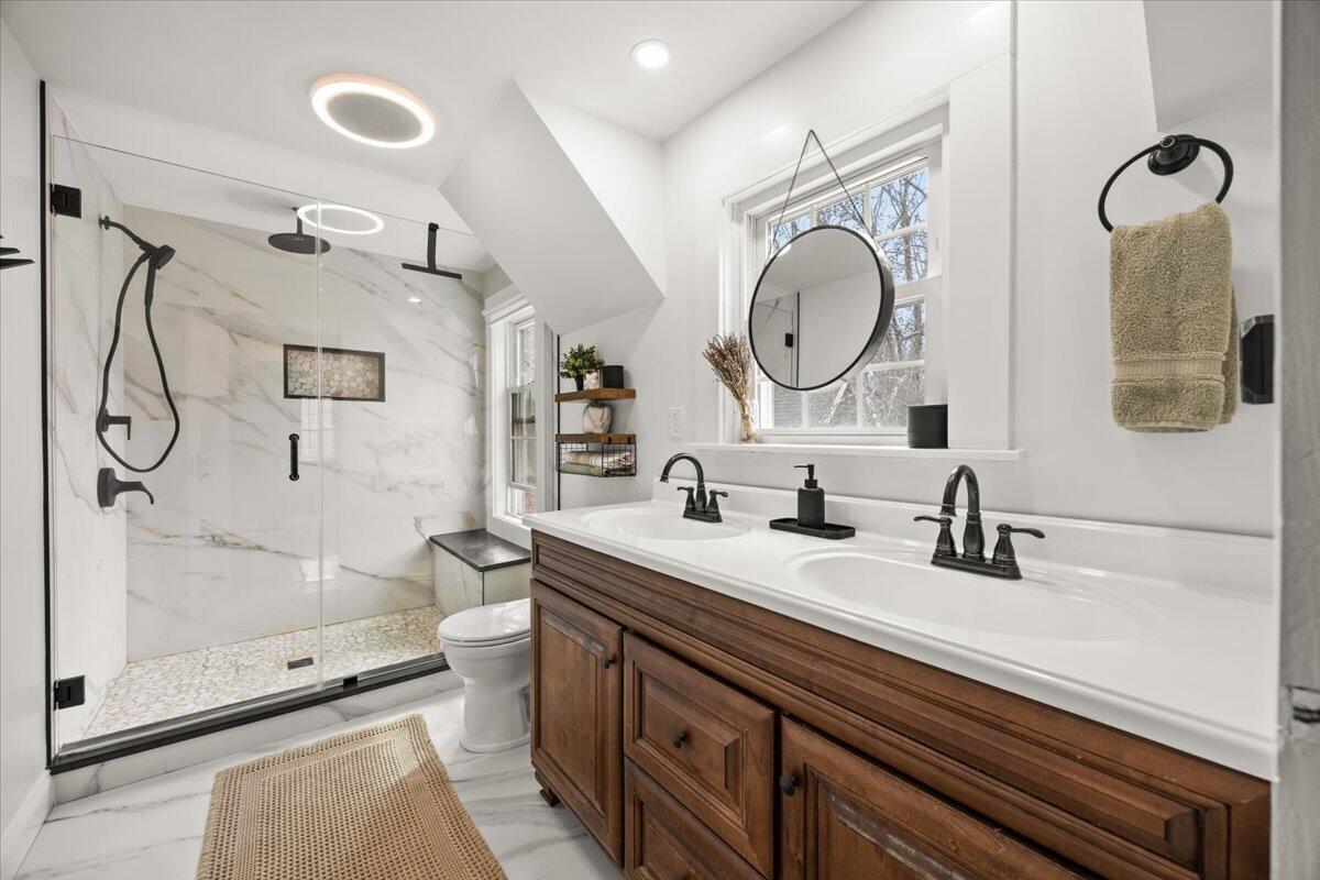 729 Center Street Dighton, MA 02764 - Photo 26 of 62 a bathroom with a granite countertop sink a mirror a vanity and a shower