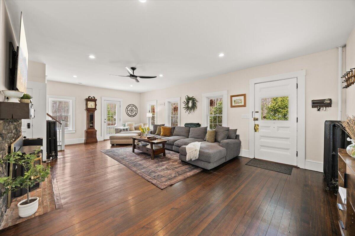 729 Center Street Dighton, MA 02764 - Photo 3 of 62 a living room with fireplace furniture and a wooden floor