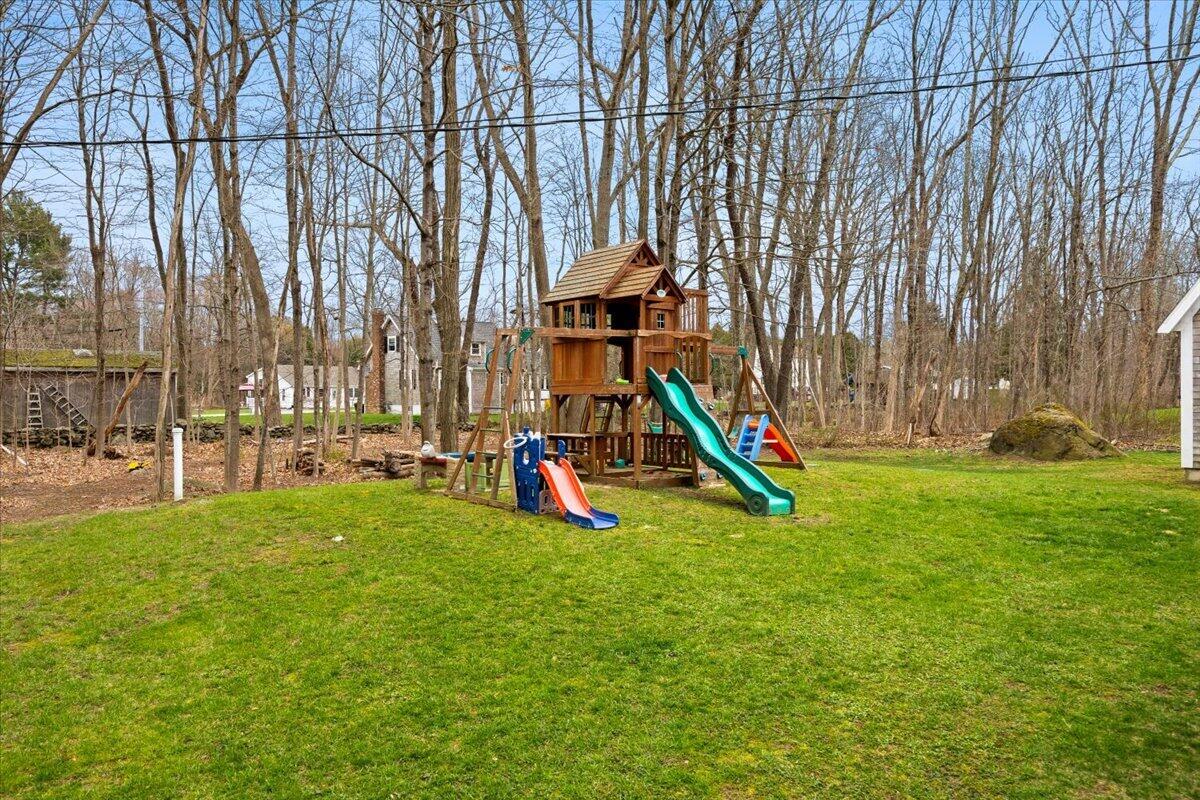 729 Center Street Dighton, MA 02764 - Photo 45 of 62 a view of a park with swings and slides