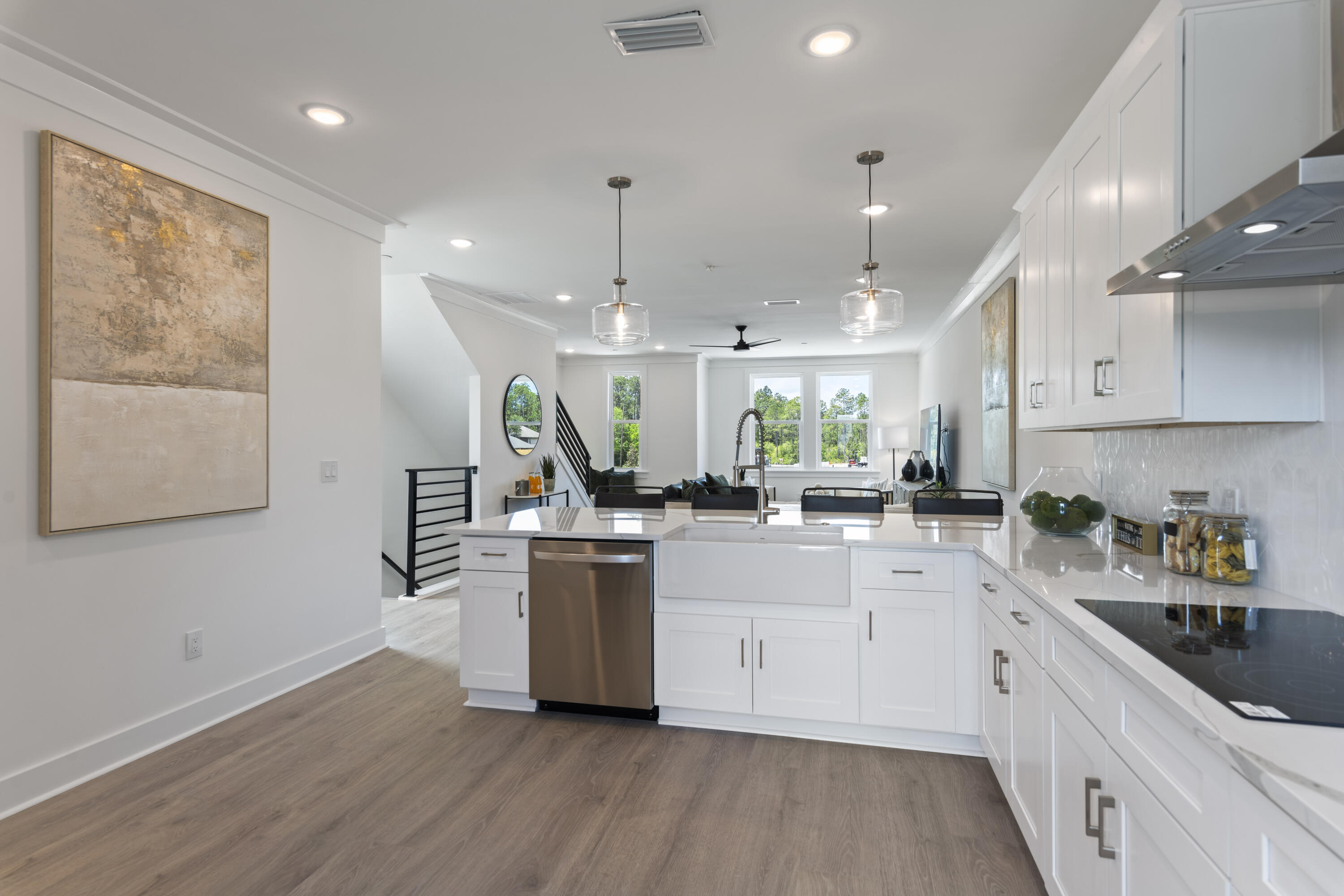 164 Blue Eden Loop, Unit LOT 6 Santa Rosa Beach, FL 32459 - Photo 14 of 32 a kitchen with stainless steel appliances granite countertop a sink a stove a refrigerator and white cabinets with wooden floor
