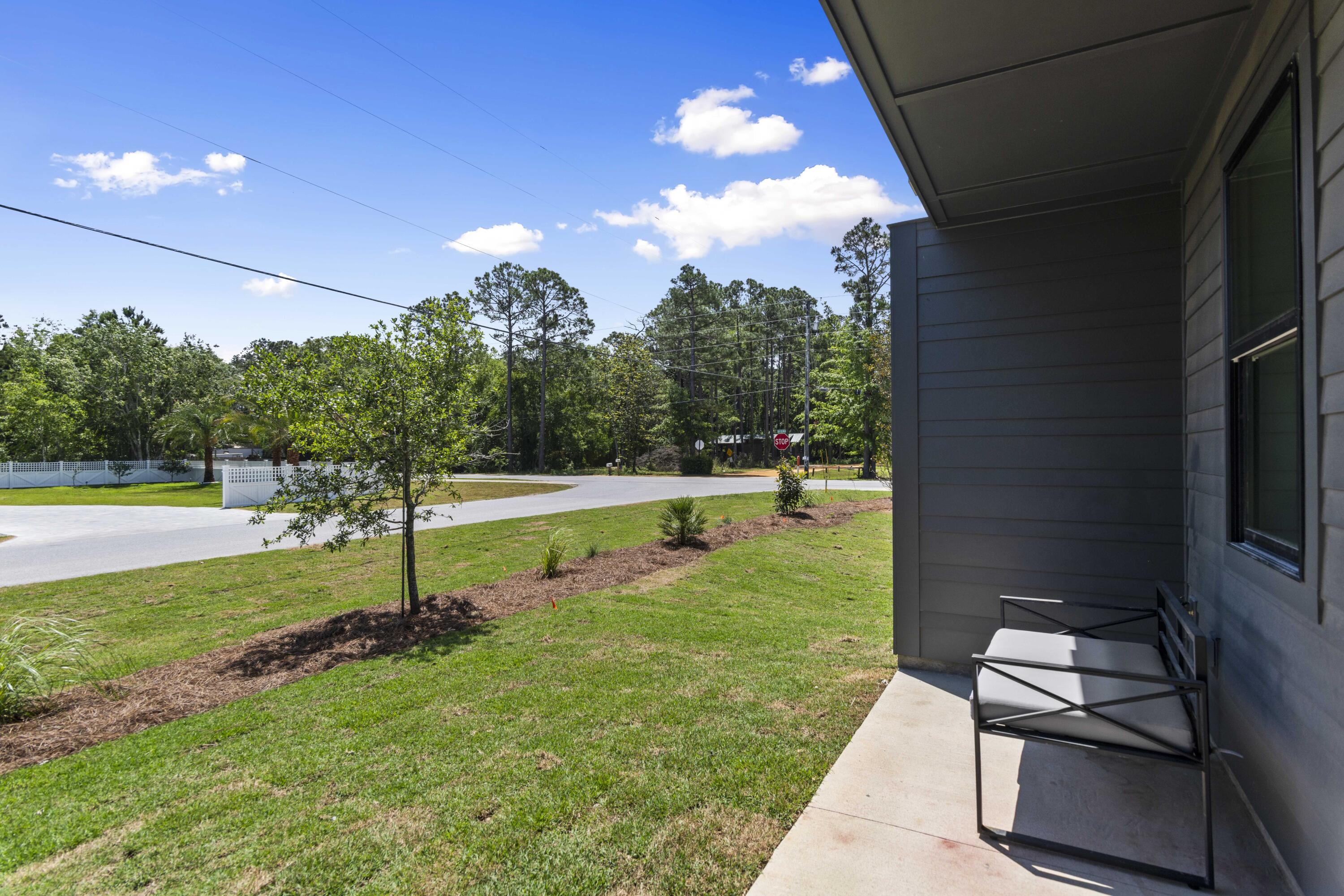 164 Blue Eden Loop, Unit LOT 6 Santa Rosa Beach, FL 32459 - Photo 30 of 32 a view of a backyard with swimming pool