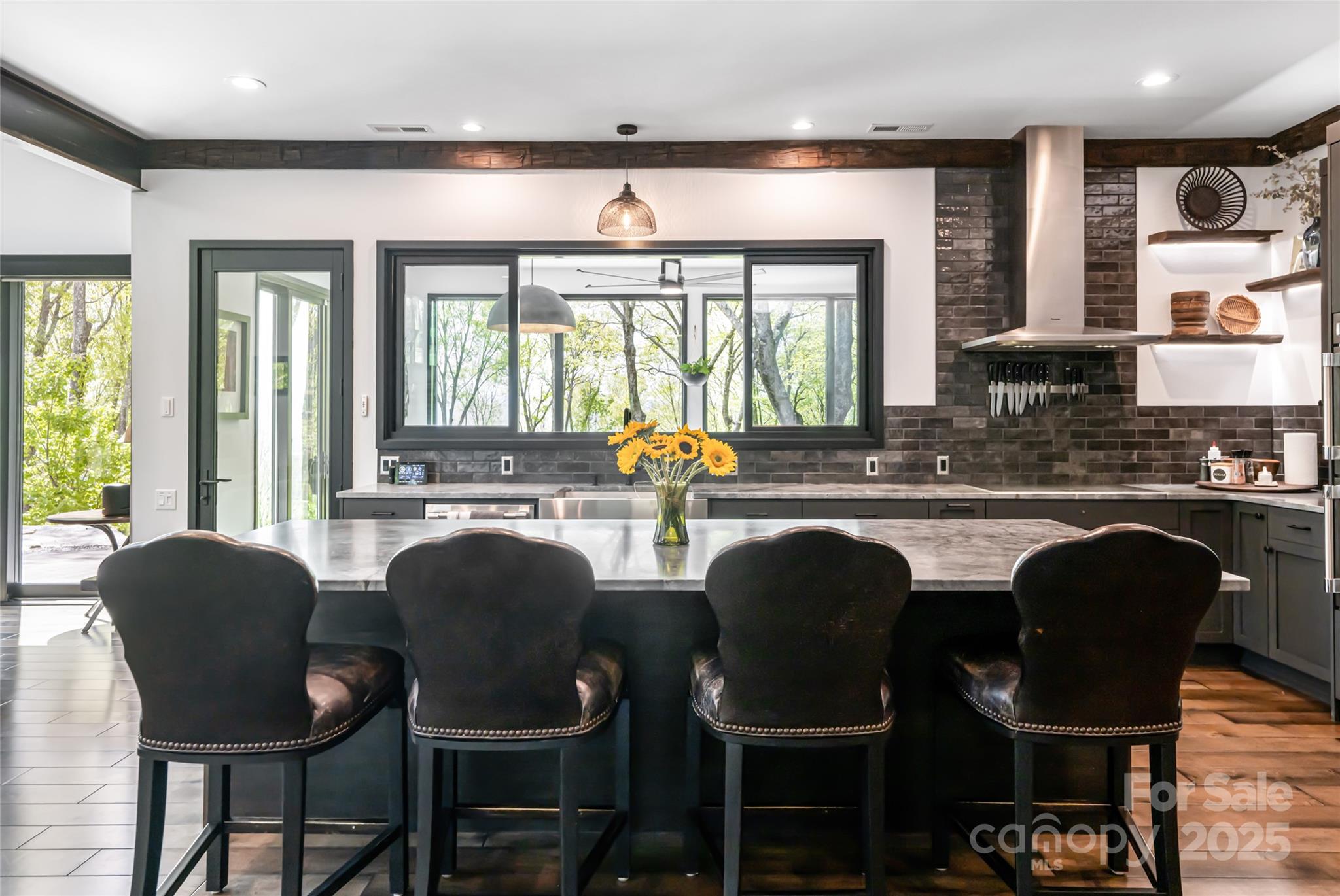 94 Laurel Ledge Way Fletcher, NC 28732 - Photo 16 of 48 a dining room with furniture a large window and chairs