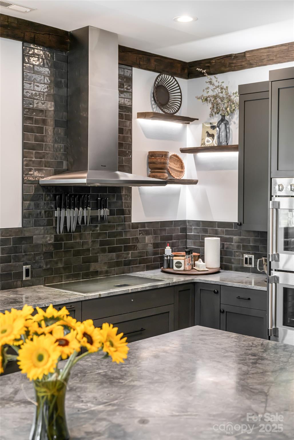 94 Laurel Ledge Way Fletcher, NC 28732 - Photo 17 of 48 a kitchen with stainless steel appliances granite countertop a sink and a stove