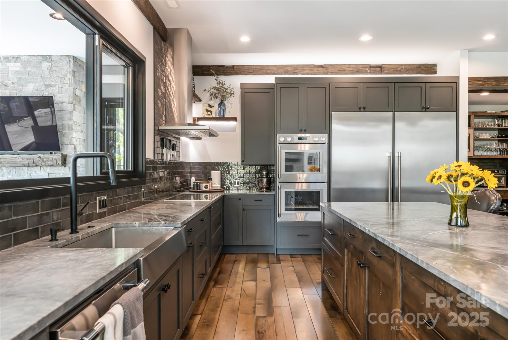 94 Laurel Ledge Way Fletcher, NC 28732 - Photo 18 of 48 a kitchen with stainless steel appliances granite countertop a sink a stove and a refrigerator