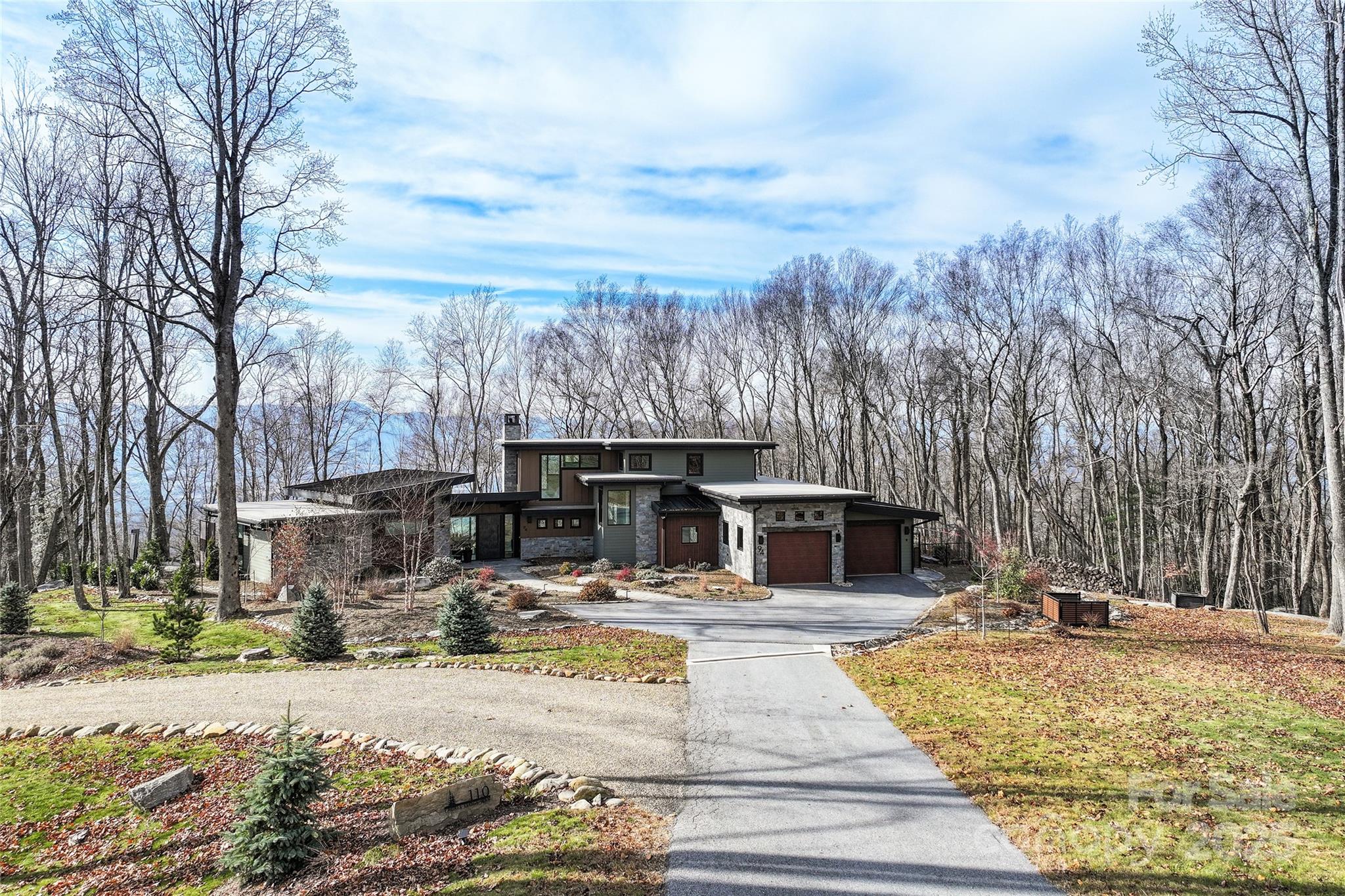 94 Laurel Ledge Way Fletcher, NC 28732 - Photo 2 of 48 a view of a house with snow on the road