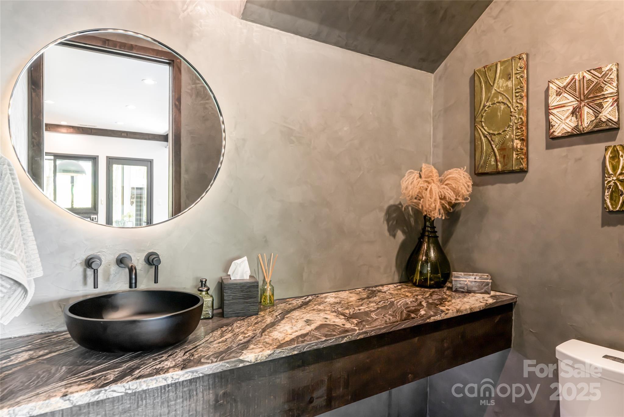 94 Laurel Ledge Way Fletcher, NC 28732 - Photo 24 of 48 a living room with a table and a potted plant