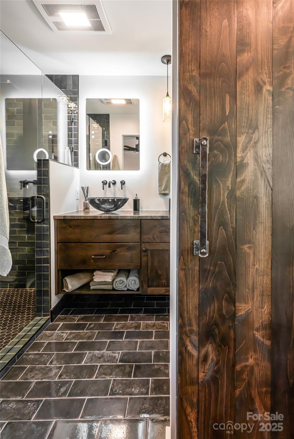 94 Laurel Ledge Way Fletcher, NC 28732 - Photo 39 of 48 a bathroom with a glass door shower and a sink