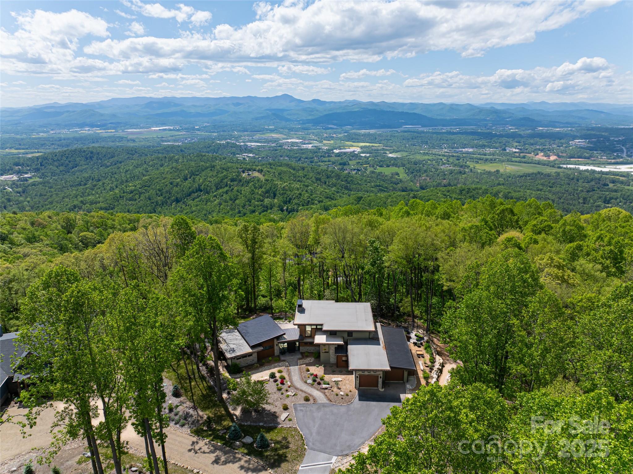 94 Laurel Ledge Way Fletcher, NC 28732 - Photo 41 of 48 a view of a lake with a city view