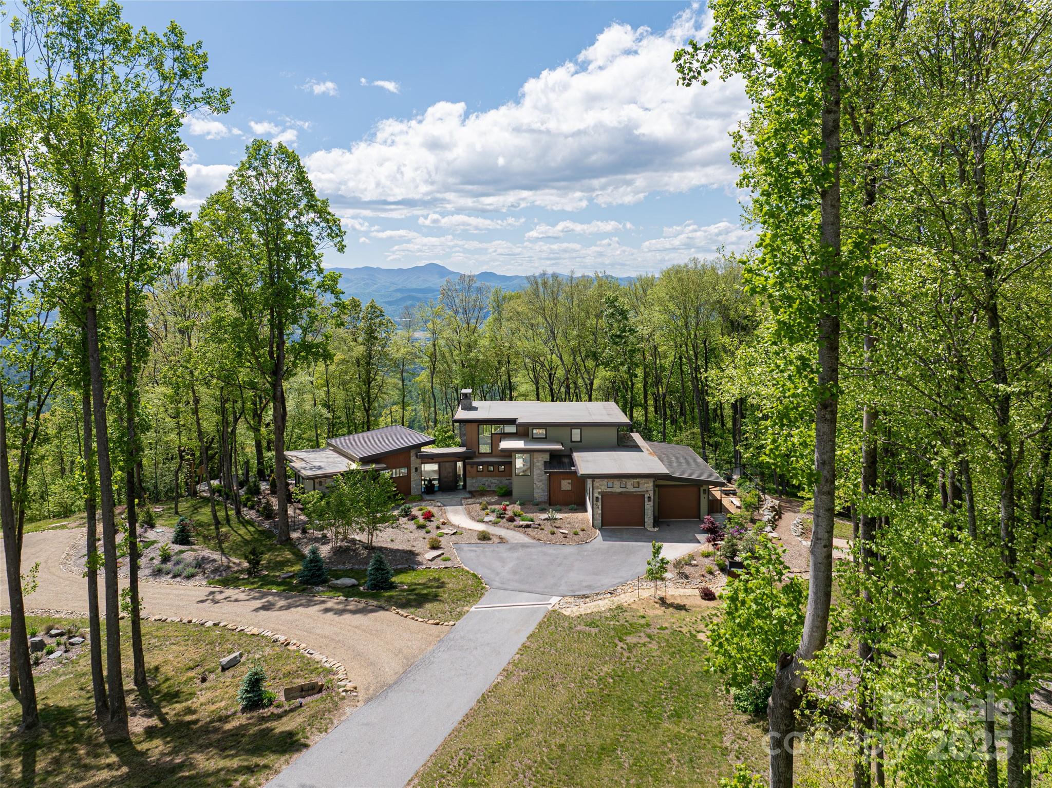 94 Laurel Ledge Way Fletcher, NC 28732 - Photo 42 of 48 a view of a patio with table and chairs and potted plants