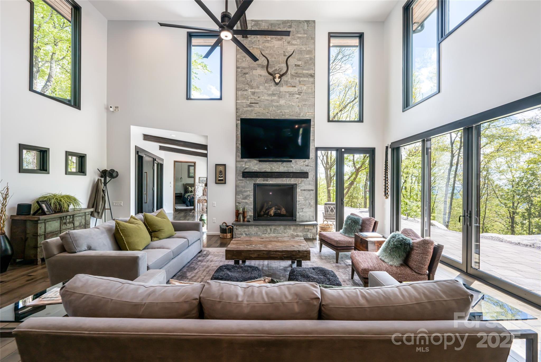 94 Laurel Ledge Way Fletcher, NC 28732 - Photo 10 of 48 a living room with furniture or outdoor view and a large window