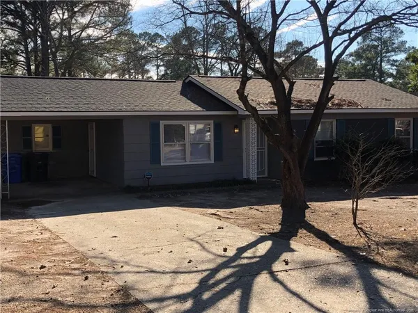 a view of a backyard of the house