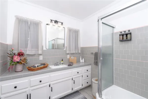 a bathroom with a shower and a toilet