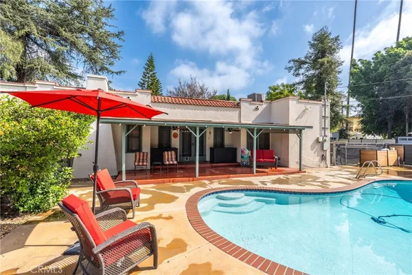 a view of a swimming pool with a patio