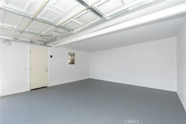 a room with furniture a flat screen tv and a table
