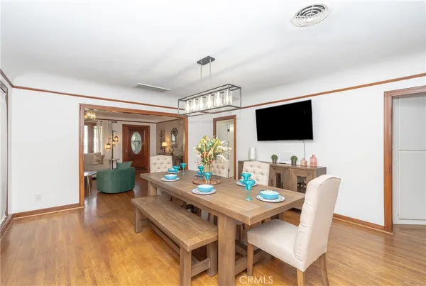 a kitchen with stainless steel appliances kitchen island granite countertop a refrigerator and a sink