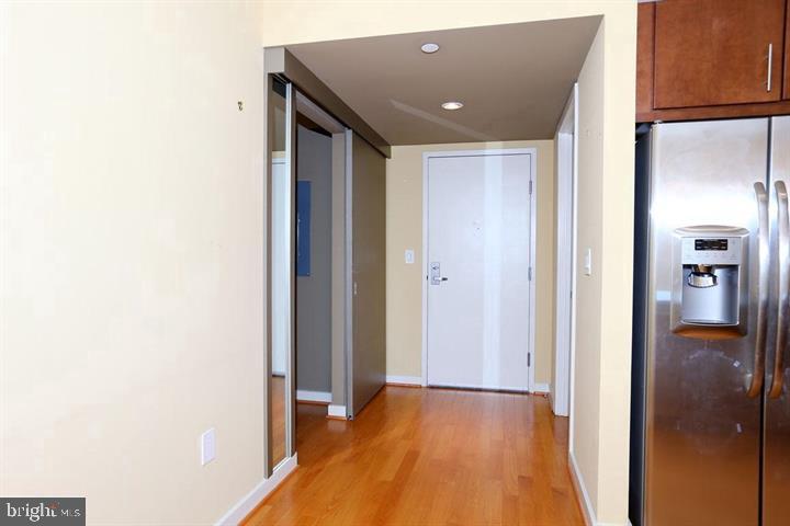 1025 First Street Southeast, Unit 1012 Washington, DC 20003 - Photo 4 of 22 a view of a hallway with wooden floor