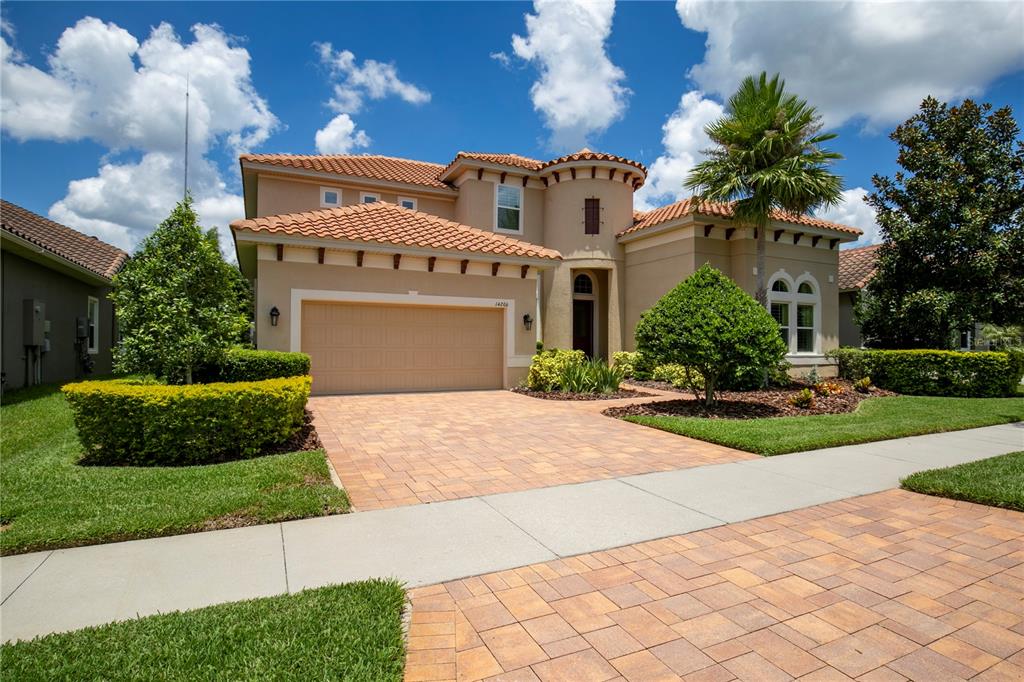 14206 Quarry Lake Road Lithia, FL 33547 - Photo 1 of 1 Manicured landscaping with driveway pavers