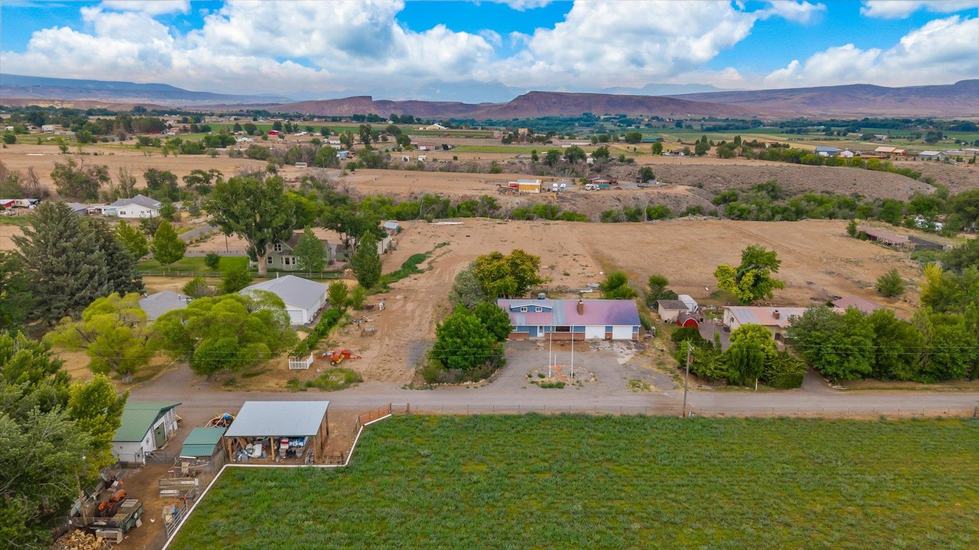 8460 Bobs Road Austin, CO 81410 - Photo 28 of 32 an aerial view of a city with lots of residential buildings lake and ocean view