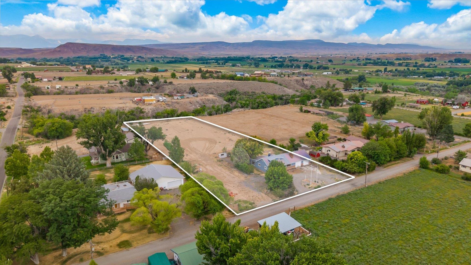 8460 Bobs Road Austin, CO 81410 - Photo 29 of 32 an aerial view of residential houses with outdoor space and city view