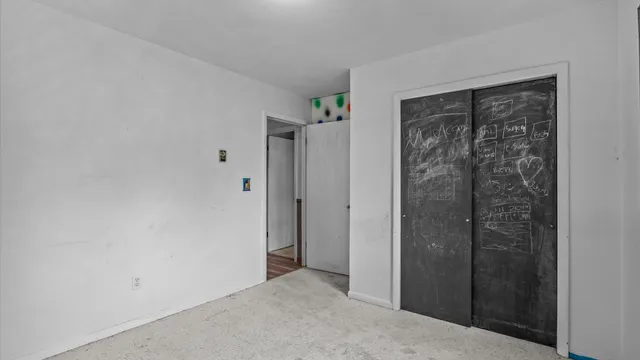 a view of an empty room with windows
