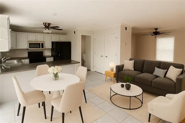 a living room with furniture a dining table and chairs