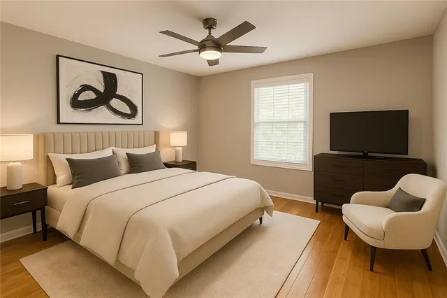 a bedroom with bed and a couch