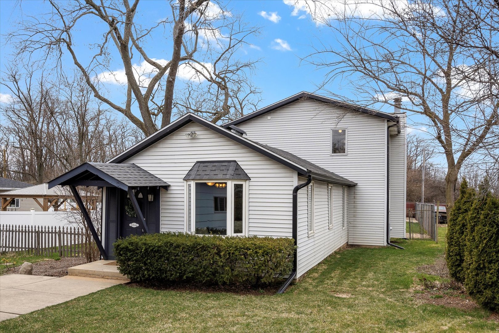 4516 Drendel Road Downers Grove, IL 60515 - Photo 1 of 29 a front view of a house with a garden