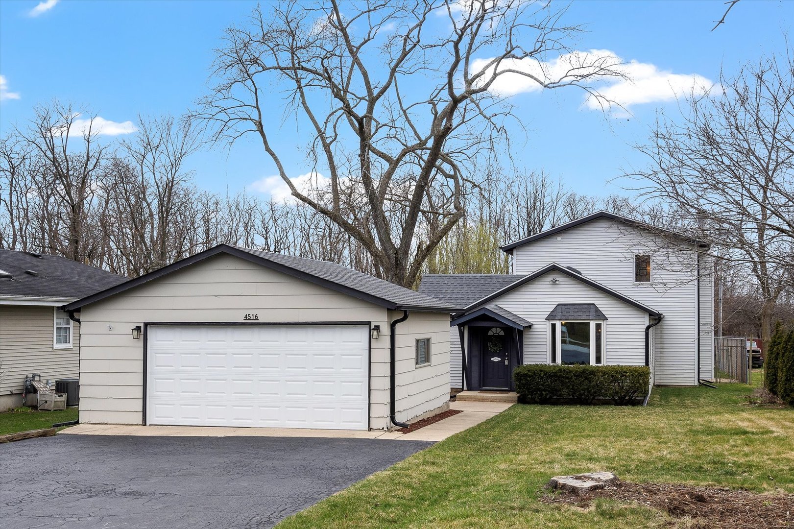 4516 Drendel Road Downers Grove, IL 60515 - Photo 27 of 29 a front view of a house with a yard and garage
