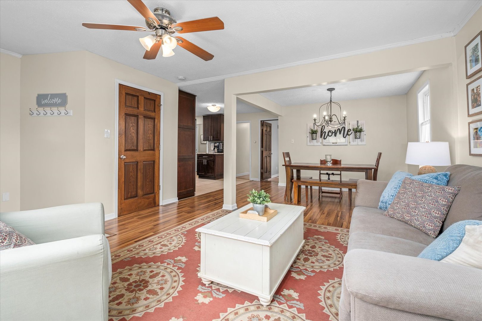 4516 Drendel Road Downers Grove, IL 60515 - Photo 5 of 29 a living room with furniture and a chandelier