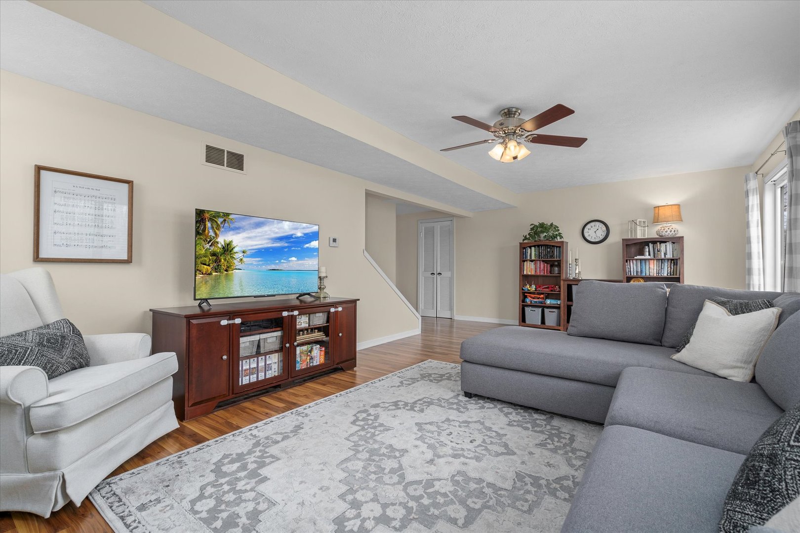 4516 Drendel Road Downers Grove, IL 60515 - Photo 9 of 29 a living room with furniture a flat screen tv and a couch