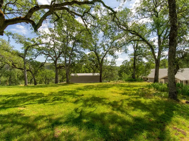 a backyard of a house with lots of green space