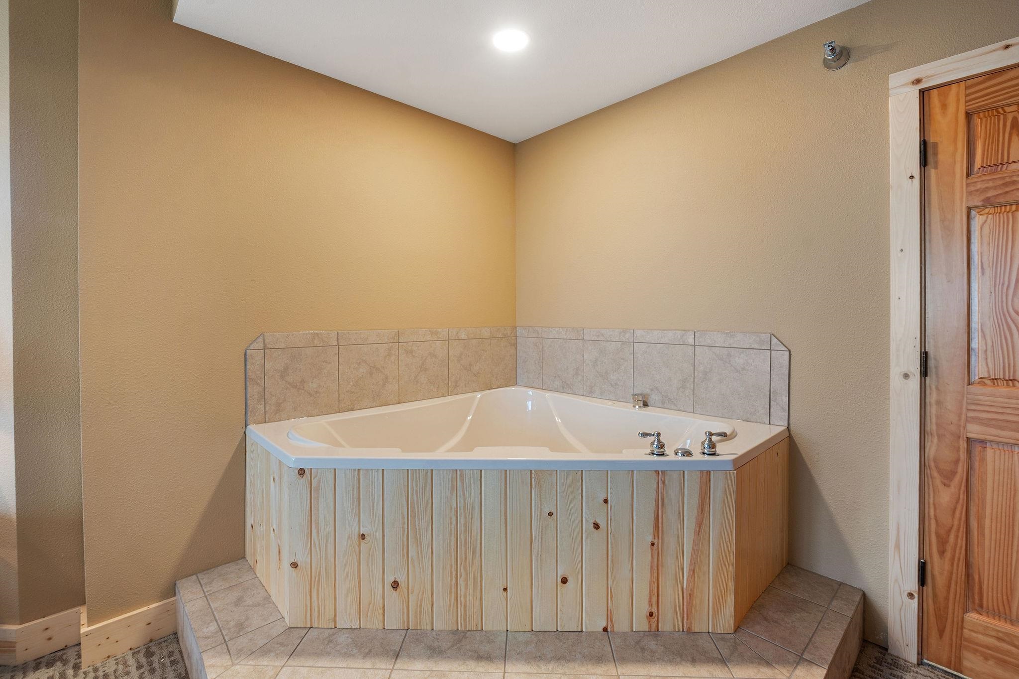 Two Burlington Road, Unit 5102 Two Harbors, MN 55616 - Photo 14 of 30 Full bath with a bath and tile patterned flooring