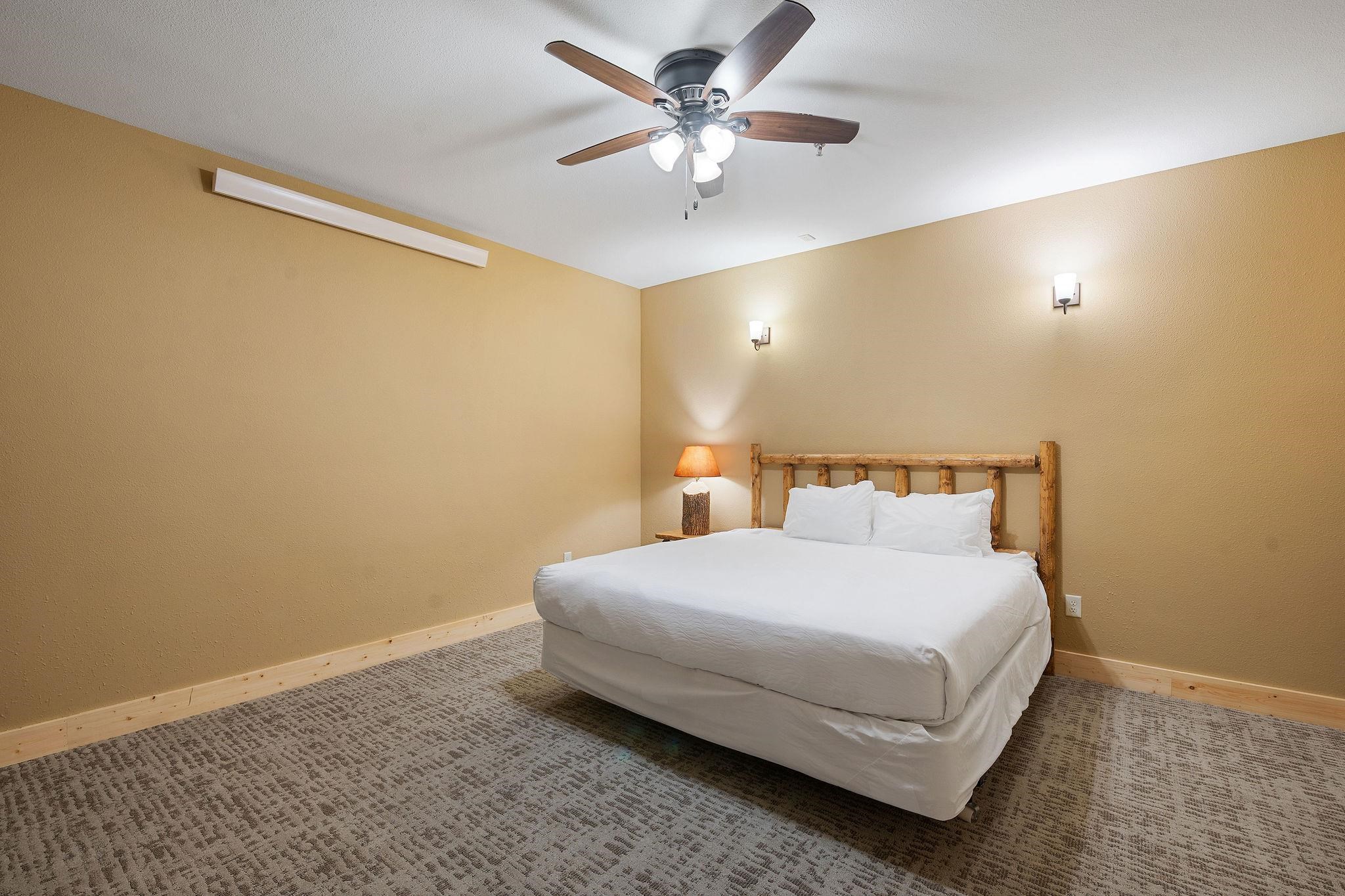 Two Burlington Road, Unit 5102 Two Harbors, MN 55616 - Photo 17 of 30 Carpeted bedroom featuring baseboards and ceiling fan
