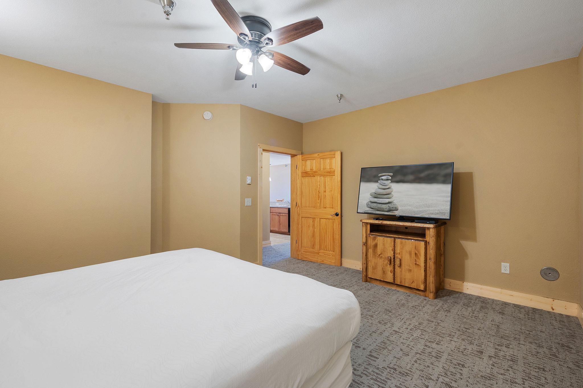 Two Burlington Road, Unit 5102 Two Harbors, MN 55616 - Photo 18 of 30 Bedroom with light carpet and ceiling fan