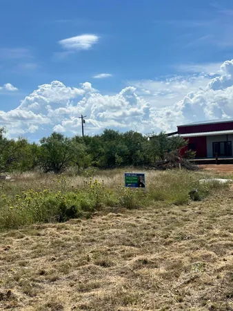 a view of a lake with a big yard