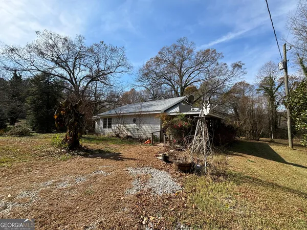 a view of a covered with trees in the background