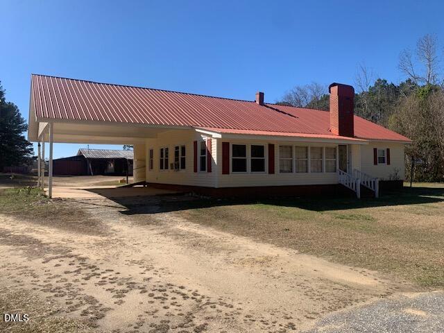 1527 Hardee Road Fuquay-Varina, NC 27526 - Photo 1 of 9 a front view of a house with a yard
